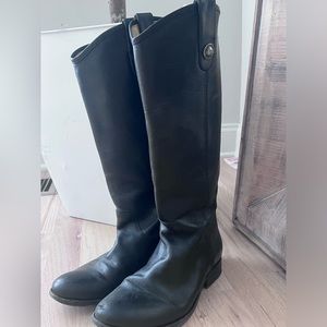 Frye black leather boots .